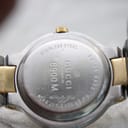 Close-up of the stainless steel case back, engraved with 'Gucci', '8900M', 'Swiss Made', 'Stainless Steel', and 'Water Resistant 3ATM'.