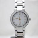 Front view of Gucci 8900L watch showing white dial with gold hands, baton indices, and two-tone stainless steel bracelet.