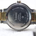 Close-up of the stainless steel case back of the Gucci 8900L, displaying model number, serial, 'Swiss Made', and 'Water Resistant 3 ATM' engravings.