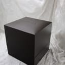 Overhead view of the closed original dark brown Gucci watch box, with the Gucci logo embossed on the lid.
