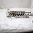 Side profile of the Gucci 8900M watch and bracelet, emphasising the alternating silver and gold-tone links.