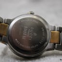 Close-up of the stainless steel case back of the Gucci 8900M, showing model number, serial 0047099, 'Swiss Made' and 'Water Resistant 3 ATM' engravings.