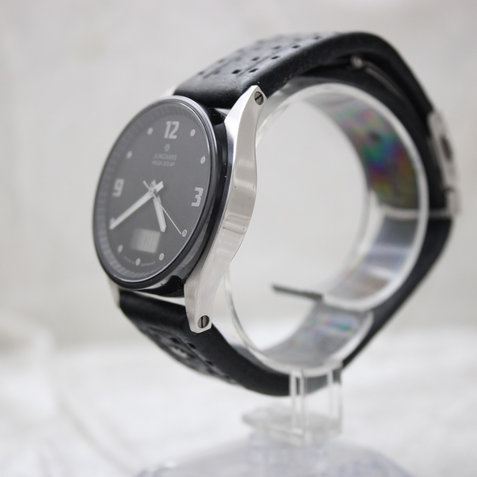 Left side profile view of the Junghans watch, showcasing its polished and brushed stainless steel case.