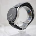 Left side profile view of the Junghans watch, showcasing its polished and brushed stainless steel case.