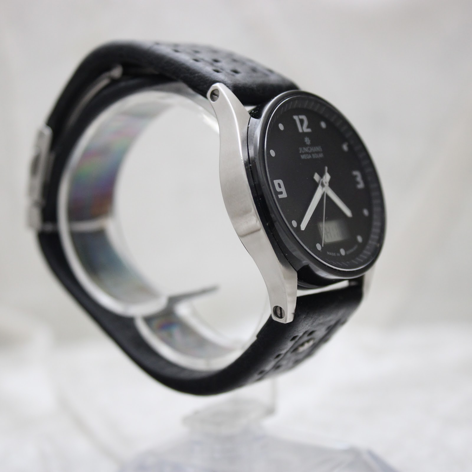 Right side profile view of the Junghans watch, highlighting the case profile and black leather strap.