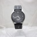 Full front view of the Junghans Mega Solar watch on a display stand, emphasising the black perforated leather strap.