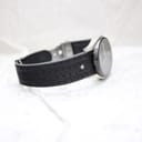 Oblique view of the perforated leather strap, featuring a subtle decorative star emblem.