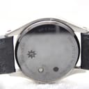 Close-up of the ceramic case back, with engravings for "Junghans Mega Solar Ceramic", "WR 5 BAR", "DCF77", and control buttons.