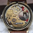Internal view of the Bulova 9X8 Swiss quartz movement from a slightly different angle, showing gears and battery.