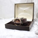The Rhino automatic watch displayed open in a vintage H. Samuel Jewellery box, showing its side profile and strap.