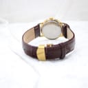 Back view of the Rotary watch, showing the stainless steel case back and the brown genuine leather strap.