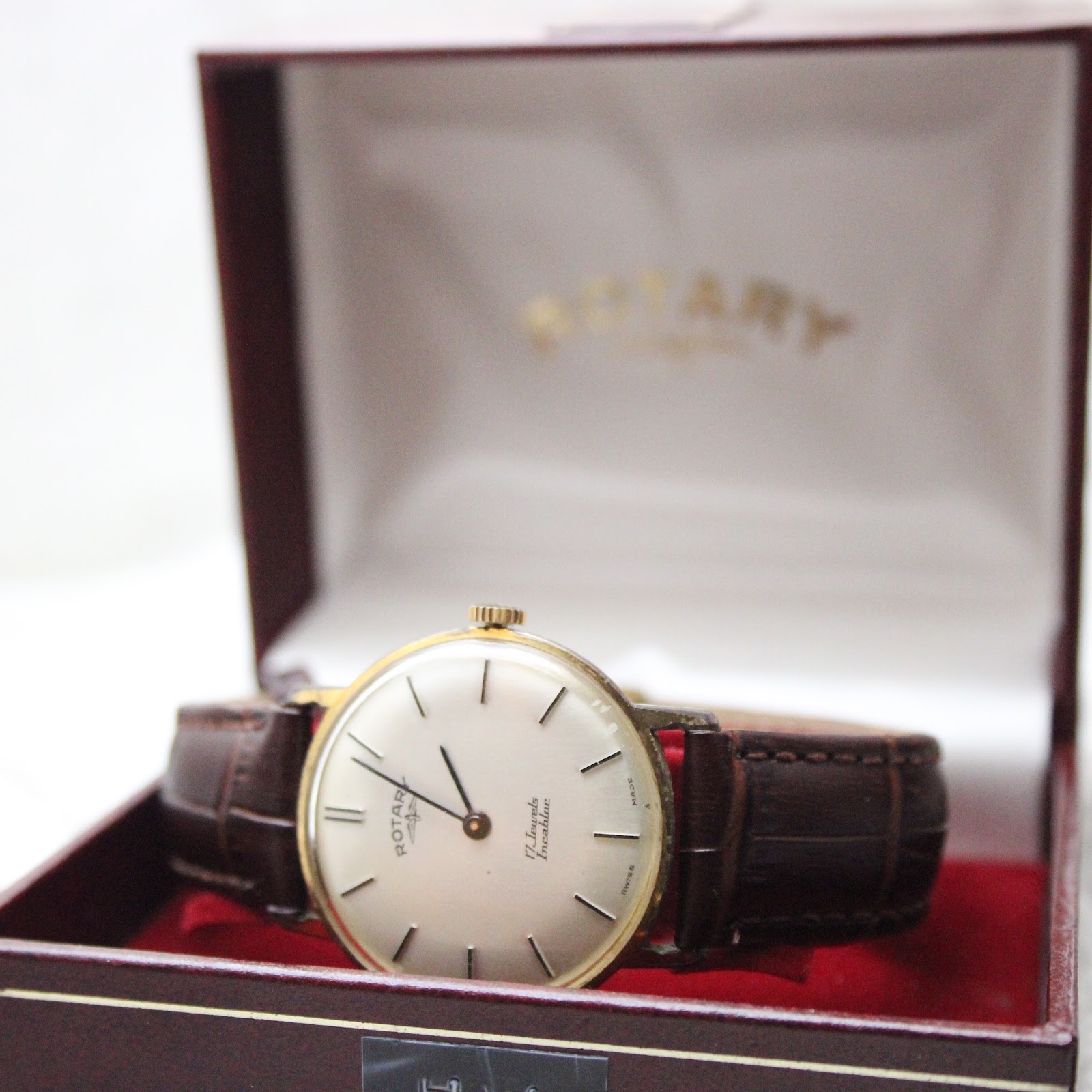 The Rotary watch presented inside its original maroon Rotary branded presentation box.