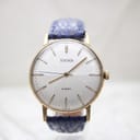 Front view of Sekonda watch with gold-plated case, silver sunburst dial, and blue leather strap.