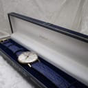 Sekonda watch on its blue strap presented in a dark blue watch box, ready for dispatch.