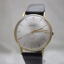 Second front view of the Mainstay watch with a clear view of the silver sunburst dial and gold baton indices.
