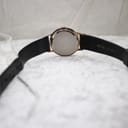Rear view of the Mainstay watch showing the stainless steel case back and the full length of the black leather strap.