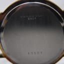 Close-up of the stainless steel case back with "stainless steel back" and reference number "11501" engraved.