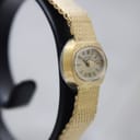 Another side-angled view of the Rotary watch, highlighting the case profile and bracelet texture.