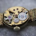 Another close-up macro view of the Swiss manual wind movement, showing 'SEVENTEEN 17 JEWELS' engraving.