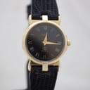 Front view of gold-plated Gucci 3400F L watch with black dial and Roman numerals.