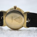Detailed view of the gold-plated case back with Gucci logo, model number 3400F L, and serial.