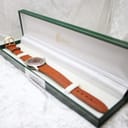 The Roamer watch displayed inside a generic green presentation box, highlighting its vintage appeal.