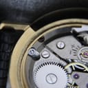 Further close-up of the open case back, showing '17 JEWELS SWISS MADE' engraved on a movement component.