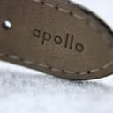 Close-up of the 'Apollo' embossing on the inside of the black leather strap.