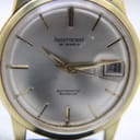 Close-up of the Aristocrat watch dial, showing the '25 jewels' text, gold-tone applied indices, and date window.