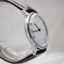 Side profile view of the Timex watch highlighting the slim case design and acrylic crystal.