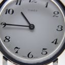 Close-up of the white Timex dial, showing the brand name, Arabic numerals, and 'GREAT BRITAIN' text.