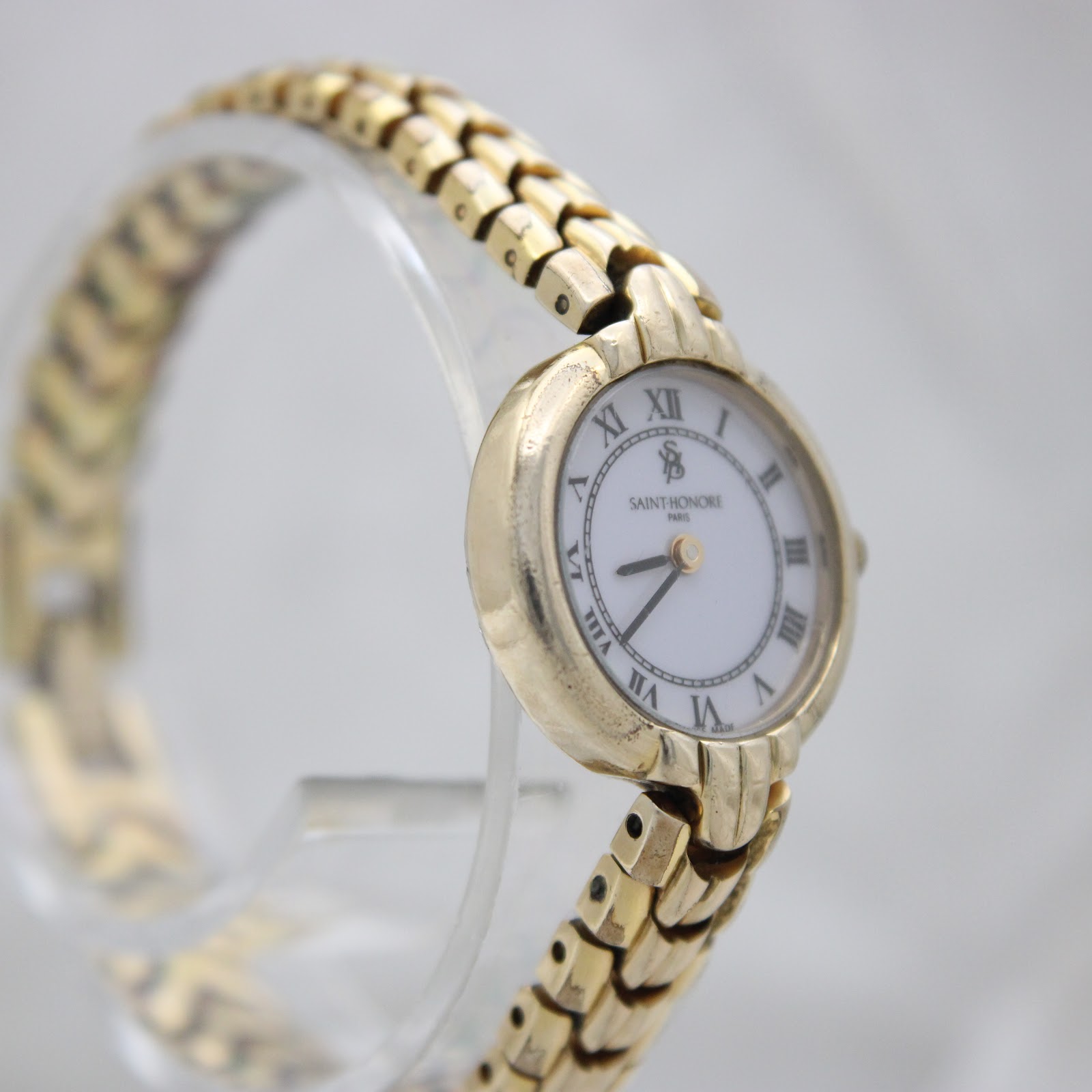 Three-quarter view of the Saint-Honoré Paris watch displaying the dial and integrated bracelet