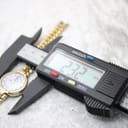 Digital caliper measuring the case diameter of the Saint-Honoré Paris watch, showing 23.2mm