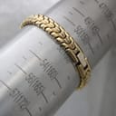 The watch bracelet on a wrist sizing gauge, indicating a wrist circumference of 150mm (15cm)