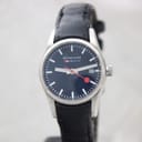 Front view of Mondaine Official Swiss Railways watch with black dial, white markers, and red seconds hand