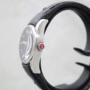 Side view of the Mondaine watch showing the brushed stainless steel case and signed crown with red 'M' logo
