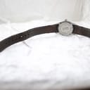 Back view of the Mondaine watch showing the case back and the full length of the black leather strap