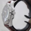 Side view of the watch showing the brushed stainless steel case and signed crown with the Wenger cross logo.