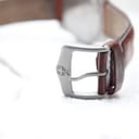 Close-up of the stainless steel pin buckle with the embossed Wenger Swiss Military cross logo.