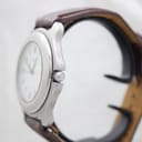 Side view of the stainless steel Swiss Army watch case and crown against a light background.