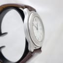 Angled side view of the Swiss Army watch showing the case profile and brown strap.