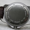 Close-up of the stainless steel caseback showing "SWISS ARMY BRAND", "WATER RESISTANT 330 FEET", and "SWISS MADE" engravings.