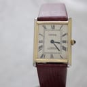Front view of the Corteal gold-tone rectangular watch with gold dial, black roman numerals, and blued-style hands.