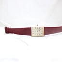 Full front view of the Corteal watch lying flat on a white surface, showcasing the gold-tone dial and burgundy strap.