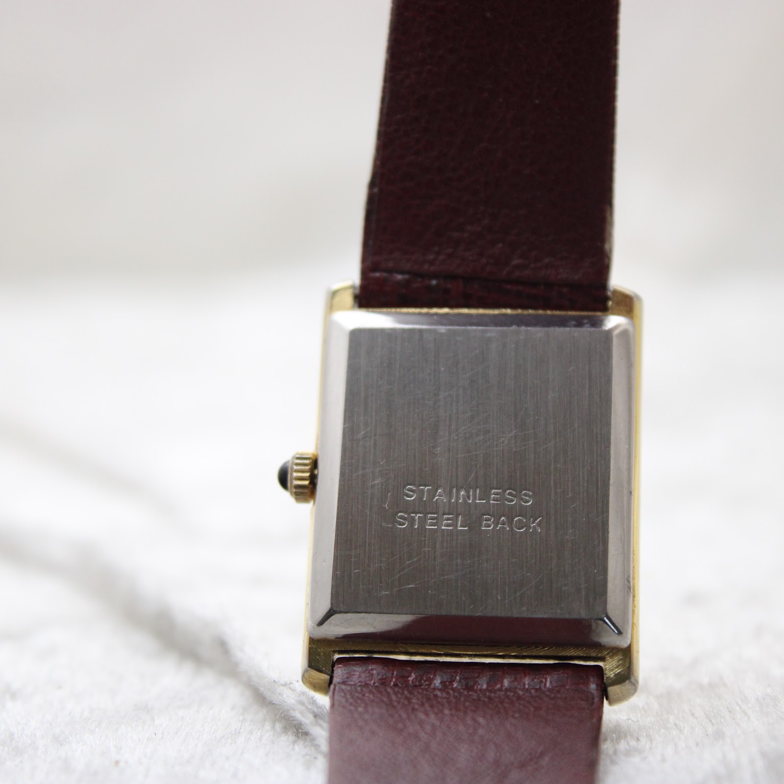Close-up of the Corteal watch's stainless steel case back with "stainless steel back" engraving.