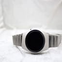Front view of the unbranded LED digital watch with the display off, showing the dark, blank face and brushed silver case.
