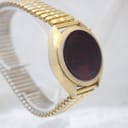 Three-quarter view of the Chronex LED watch, highlighting the brushed texture of the gold-tone case and the segmented expansion bracelet.