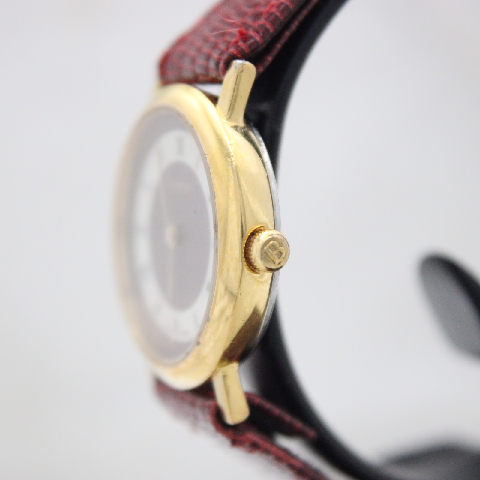 Side view of the Burberrys watch showing the gold-tone case and signed crown.