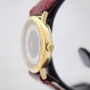 Side view of the Burberrys watch showing the gold-tone case and signed crown.