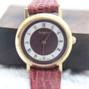 Front view of the Burberrys watch, positioned on a brown background, emphasising the dial details.